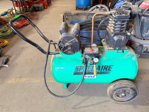 SPEEDAIRE PORTABLE HORIZONTAL ELECTRIC AIR COMPRESSOR WITH 20-GALLON AIR RECEIVER, OIL-LUBRICATED BELT-DRIVE PUMP, PRESSURE SWITCH, REGULATOR, PRESSURE GAUGE, BELT GUARD, WHEELS, AND HANDLE.