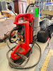 MILWAUKEE ELECTROMAGNETIC DRILL PRESS WITH PORTABLE MAGNETIC BASE, VARIABLE DRILL SPEED CONTROL, FORWARD/REVERSE CONTROLS, MAGNET ON/OFF CONTROL, MANUAL FEED HANDLE, AND CORDED ELECTRIC POWER.