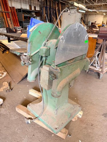 HEAVY-DUTY DOUBLE-END PEDESTAL DISC SANDER WITH TWO LARGE SANDING DISCS, ADJUSTABLE CAST-IRON WORK TABLES, TILTING TABLE MECHANISMS, PARTIAL DISC GUARDS, DUST COLLECTION PORTS, AND FLOOR-MOUNT PEDESTAL BASE.
