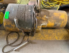 ELECTRIC WIRE ROPE HOIST WITH HEAVY-DUTY CYLINDRICAL HOUSING, INTEGRAL ELECTRIC MOTOR, WIRE ROPE DRUM, SUSPENSION MOUNTING ASSEMBLY, AND PENDANT CONTROL.