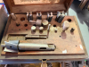 COUNTERBORE CUTTERS, PILOTS, AND HOLDERS IN FITTED WOODEN STORAGE CASE. (PARTIAL)