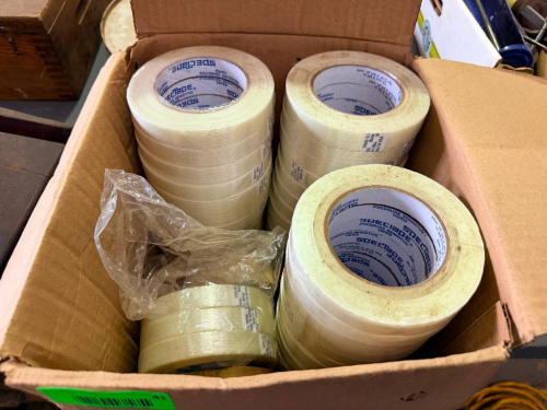 BOX LOT OF SPECTAPE PRESSURE-SENSITIVE FILAMENT-REINFORCED PACKAGING TAPE, INCLUDING MULTIPLE FULL AND PARTIAL ROLLS IN ASSORTED WIDTHS.