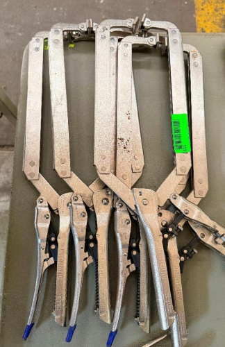 4) LONG-REACH LOCKING CLAMPS WITH METAL FRAMES, ADJUSTABLE SPINDLES, SWIVEL PADS, AND TOGGLE-STYLE LOCKING HANDLES.