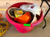 RED PLASTIC CONTAINER W/ CONTENTS - HARD HATS