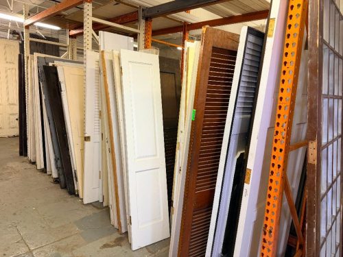 (1) LOT OF ASSORTED RECLAIMED VINTAGE DOORS. PALLET RACKING IS NOT INCLUDED.