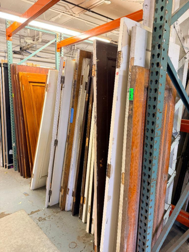 (1) LOT OF ASSORTED RECLAIMED VINTAGE DOORS. PALLET RACKING IS NOT INCLUDED.