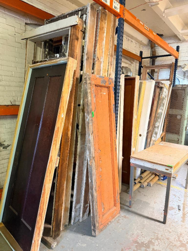 (1) LOT OF ASSORTED RECLAIMED VINTAGE DOORS. PALLET RACKING IS NOT INCLUDED.
