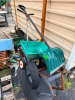 WHEELBARROW, (2) DROP SPREADERS, AND (1) SHOVEL.