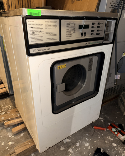 WASCOMAT EX 25 EMERALD SERIES COMMERCIAL FRONT-LOAD COIN-OPERATED WASHING MACHINE WITH STAINLESS STEEL WASH DRUM, PROGRAMMABLE WASH CYCLES, DIGITAL DISPLAY, DETERGENT/SOFTENER DISPENSING SYSTEM, AND COIN ACCEPTOR.