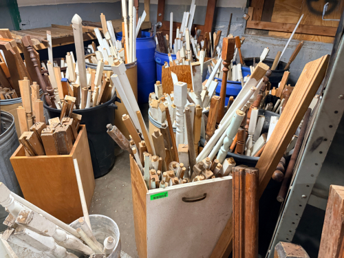 (1) LARGE LOT OF ASSORTED WOODEN BANISTER POSTS AND SPINDLES.