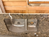 12' GRANITE COUNTERTOP WITH UNDERMOUNT DOUBLE-BOWL STAINLESS STEEL SINK, POLISHED FRONT EDGE, FAUCET/ACCESSORY CUTOUTS, AND MATCHING GRANITE END SECTION. - 2