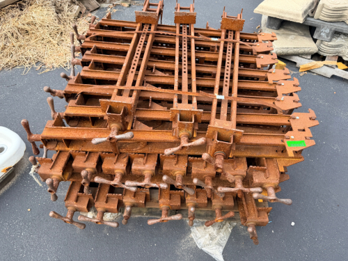 LOT OF HEAVY-DUTY STEEL BAR CLAMPS WITH ADJUSTABLE SLIDING JAWS, SCREW-TYPE HANDLES, AND PERFORATED STEEL BARS.
