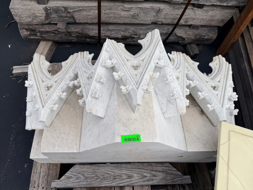 ORNATE CARVED WHITE MARBLE ARCHITECTURAL BRACKETS WITH GOTHIC-STYLE POINTED ARCH DESIGN, TREFOIL DETAILS, MOLDED EDGES, AND DECORATIVE FOLIATE ELEMENTS. PACKAGE INCLUDES MULTIPLE MATCHING BRACKETS AND MARBLE BASE/SLAB PIECES.