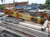 HYDRAULIC BELT-DRIVEN CUTTING SAW ASSEMBLY WITH LONG STEEL SUPPORT ARM, LARGE CIRCULAR BLADE GUARD, HYDRAULIC HOSES, DRIVE PULLEYS, AND MOUNTING HARDWARE.