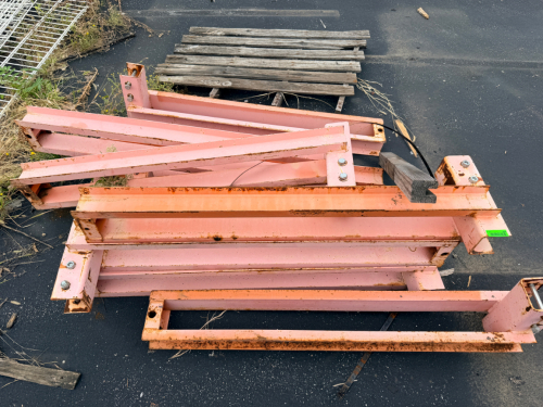 LOT OF HEAVY-DUTY STEEL SUPPORT FRAME ASSEMBLIES WITH WELDED CHANNEL CONSTRUCTION, BOLTED MOUNTING PLATES, AND ORANGE/RED PAINTED FINISH.