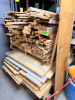 PALLET OF ASSORTED CUT LUMBER AND SHEETS OF PARTICLE BOARD.