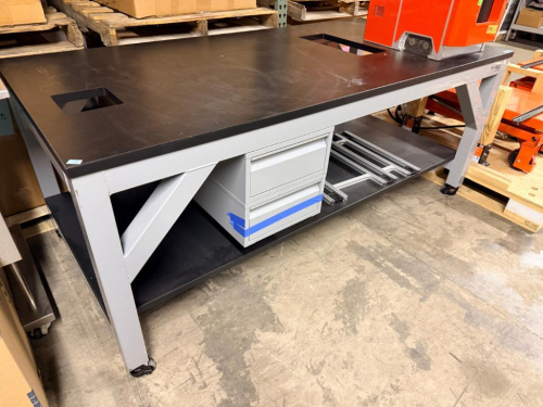 8' HEAVY-DUTY MOBILE LABORATORY WORKBENCH WITH STEEL FRAME, BLACK WORK SURFACE, FULL-LENGTH LOWER STORAGE SHELF, SUSPENDED THREE-DRAWER CABINET AND TWO WORK-SURFACE ACCESS OPENINGS.
