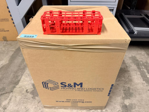 (1) BOX OF ASSORTED PLASTIC LABORATORY TEST TUBE RACKS AND SAMPLE TUBE HOLDERS IN VARIOUS SIZES, CONFIGURATIONS, AND COLORS. INCLUDES RED, BLUE, WHITE, PURPLE, ORANGE, YELLOW, AND OTHER ASSORTED RACKS. SOLD AS ONE BULK LOT WITH CONTENTS OF CARTON.