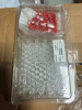 (2) PACKS OF VIALS WITH RED SCREW CAPS PACKAGED IN CLEAR PLASTIC TRAYS. LARGE LOT CONSISTING OF MULTIPLE TRAYS DISTRIBUTED BETWEEN TWO BOXES.