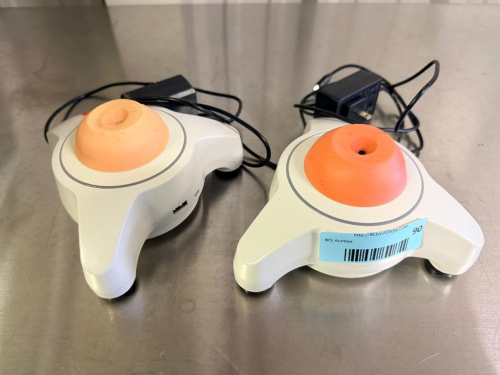 (2) TRAVELERNT MINI VORTEX MIXERS WITH ORANGE RUBBER MIXING CUPS, THREE-LEG BENCHTOP BASES, ON/OFF SWITCHES AND POWER ADAPTERS.