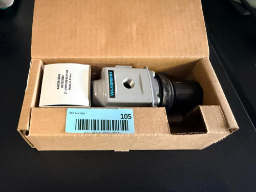 WILKERSON PNEUMATIC PRESSURE REGULATOR WITH ADJUSTABLE CONTROL KNOB AND THREADED AIR CONNECTIONS.