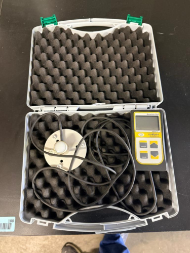 APOGEE INSTRUMENTS QUANTUM FLUX LIGHT METER WITH HANDHELD DIGITAL METER, REMOTE QUANTUM SENSOR, ATTACHED CABLE AND FOAM-LINED CARRYING CASE.