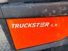 JACOBSEN TRUCKSTER LX GAS POWERED UTILITY VEHICLE WITH TWO-PERSON BENCH SEAT, REAR CARGO BED, WINDSHIELD, CANOPY TOP, FRONT BRUSH GUARD, HEADLIGHTS, TAILLIGHTS, HORN, 12V ACCESSORY OUTLET, DIAMOND-PLATE FLOOR, PARKING BRAKE, AND REAR RECEIVER HITCH. - 13