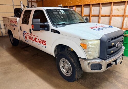 2012 FORD F-350 SUPER DUTY CREW CAB SERVICE TRUCK WITH READING UTILITY BODY, MULTIPLE LOCKING STORAGE COMPARTMENTS, CHAMPION R-SERIES GAS ENGINE DRIVEN AIR COMPRESSOR WITH KOHLER ENGINE, HOSE REELS, FLUID TRANSFER EQUIPMENT, REAR MOUNTED BENCH VISE, REAR 