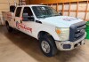 2012 FORD F-350 SUPER DUTY CREW CAB SERVICE TRUCK WITH READING UTILITY BODY, MULTIPLE LOCKING STORAGE COMPARTMENTS, CHAMPION R-SERIES GAS ENGINE DRIVEN AIR COMPRESSOR WITH KOHLER ENGINE, HOSE REELS, FLUID TRANSFER EQUIPMENT, REAR MOUNTED BENCH VISE, REAR 