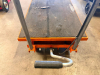 1,100 LB. CAPACITY MANUAL HYDRAULIC LIFT TABLE CART WITH STEEL PLATFORM, NON-SLIP RUBBER DECK SURFACE, FOOT-OPERATED HYDRAULIC PUMP, MANUAL LOWERING CONTROL, PUSH HANDLE, AND FOUR SWIVEL CASTERS. - 3