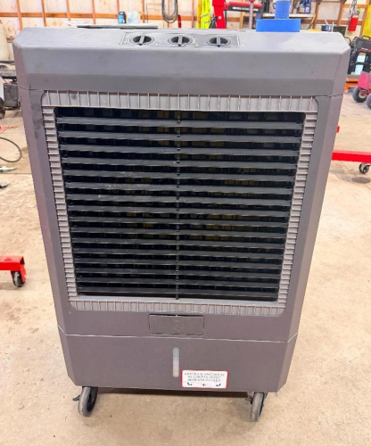HESSAIRE MOBILE EVAPORATIVE AIR COOLER WITH FRONT ADJUSTABLE AIR LOUVERS, THREE ROTARY CONTROL KNOBS, REAR COOLING MEDIA PANELS, INTEGRATED WATER RESERVOIR, AND CASTERS.
