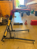 TRAXION ORIGINAL TOPSIDE CREEPER WITH ADJUSTABLE HEIGHT, FOLDABLE STEEL FRAME, PADDED UPPER BODY SUPPORT, THREE NON-SLIP STEPS, AND SWIVEL CASTERS.