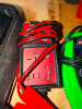 (4) ASSORTED AUTOMOTIVE DIAGNOSTIC AND TESTING TOOLS INCLUDING OBD-II DIAGNOSTIC INTERFACE, OEM TOOLS ELECTRONIC BATTERY TESTER, DIGITAL INFRARED THERMOMETER, AND ELECTRICAL CIRCUIT TESTER WITH LEADS AND ACCESSORIES. - 4