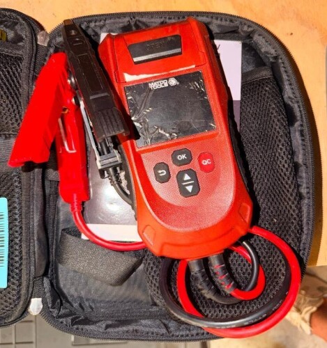 MATCO TOOLS MAXBATADV DIGITAL AUTOMOTIVE BATTERY AND ELECTRICAL SYSTEM TESTER WITH LCD DISPLAY, CONTROL BUTTONS, BATTERY TEST LEADS, ALLIGATOR CLAMPS, AND ZIPPERED CARRYING CASE.