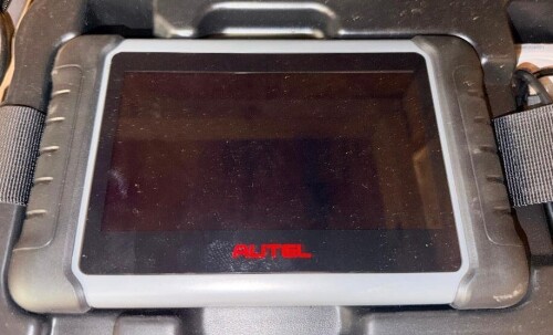 AUTEL MAXIPRO MP808BT PRO AUTOMOTIVE DIAGNOSTIC SCAN TOOL WITH TOUCHSCREEN DISPLAY, WIRELESS VEHICLE COMMUNICATION INTERFACE, CONNECTING CABLES, POWER ADAPTER, AND HARD PLASTIC CARRYING CASE.
