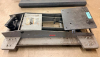 PITTSBURGH AUTOMOTIVE HYDRAULIC MOTORCYCLE / ATV LIFT JACK WITH STEEL FRAME, ADJUSTABLE FOUR-POINT SUPPORT PLATFORM, HYDRAULIC LIFTING MECHANISM, AND REMOVABLE HANDLE COMPONENTS.
