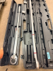 (2) LONG-HANDLE TORQUE WRENCHES WITH RATCHETING HEADS, ADJUSTABLE TORQUE SETTINGS, METAL HANDLES, AND INDIVIDUAL HARD PLASTIC STORAGE CASES.