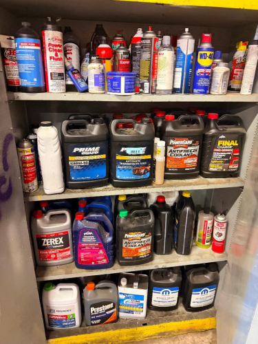LARGE ASSORTMENT OF AUTOMOTIVE FLUIDS, LUBRICANTS, ANTIFREEZE, TRANSMISSION FLUID, GEAR OIL, BRAKE FLUID, GREASE, CLEANERS, PENETRATING OIL AND ASSORTED AUTOMOTIVE CHEMICALS. INCLUDES ASSORTED GALLON CONTAINERS, QUART BOTTLES, AEROSOL CANS AND BOXED PRODU
