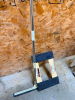LONG HANDLE FLOOR SQUEEGEE WITH METAL HANDLE AND RUBBER BLADE, INCLUDES WOODEN FURNITURE DOLLY WITH CARPETED SUPPORTS AND FOUR CASTERS. - 2