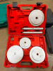 AUTOMOTIVE WHEEL BEARING AND SEAL DRIVER TOOL KIT WITH ASSORTED ALUMINUM DRIVER DISCS, THREADED HANDLES AND ADAPTERS IN RED MOLDED PLASTIC CARRYING CASE.