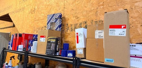 ASSORTED AUTOMOTIVE REPLACEMENT PARTS INCLUDING FUEL FILTERS, OIL FILTERS, AIR FILTERS, HOSES, WIRING COMPONENTS, ELECTRICAL PARTS, ABRASIVE PADS, AND OTHER AUTOMOTIVE SUPPLIES. ASSORTED BOXED AND LOOSE INVENTORY.