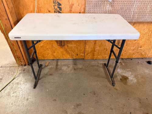 48" WHITE PLASTIC FOLDING TABLE.