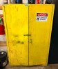 DOUBLE DOOR STEEL FLAMMABLE MATERIAL STORAGE CABINET WITH YELLOW FINISH, HINGED DOORS, METAL LATCHING HANDLES, AND FLAMMABLE STORAGE WARNING LABEL.