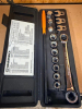 GEARWRENCH SERPENTINE BELT TOOL SET WITH RATCHETING WRENCH, EXTENSION HANDLE, ASSORTED SOCKETS, CROWFOOT WRENCHES, DRIVE ADAPTERS, AND MOLDED PLASTIC CARRYING CASE.