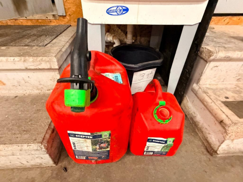 (2) ASSORTED RED PLASTIC FUEL CANS.