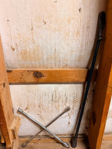 TIRE CROSS AND CROWBAR.