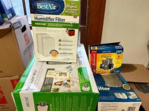 BOX OF ASSORTED HEATER AND HUMIDIFIER FILTERS.