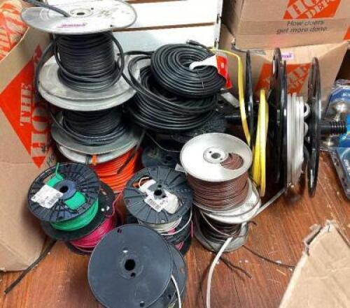 ASSORTED SPOOLS OF ELECTRICAL WIRE AND CABLE.