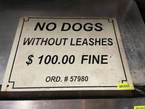 "NO DOGS WITHOUT LEASHES" $100 FINE. SIGN