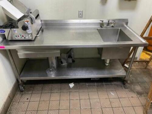 DESCRIPTION: 76" X 30" HEAVY DUTY STAINLESS TABLE W/ RIGHT HAND SINK. ADDITIONAL INFORMATION W/ 6" BACK SPLASH SIZE 76" X 30" LOCATION: KITCHEN QTY: 1